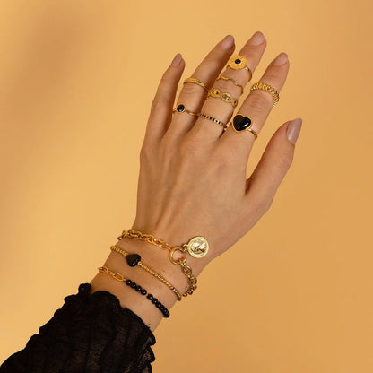 Ring met Ronde Glassteen & Getwist Randje • Zwart • Goud